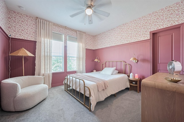 4107 Rainflower Ct, Fulshear, TX 77441 - bedroom with wallpapered walls, wainscoting, carpet, and ceiling fan