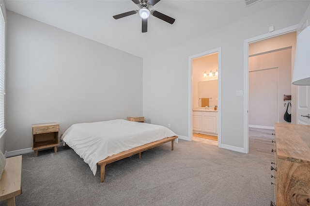 4107 Rainflower Ct, Fulshear, TX 77441 - bedroom with light carpet, ensuite bath, and ceiling fan