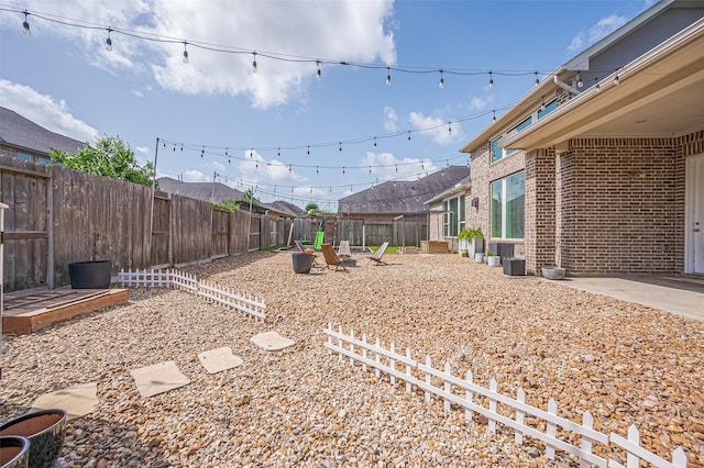 4107 Rainflower Ct, Fulshear, TX 77441 - fenced backyard with a patio area