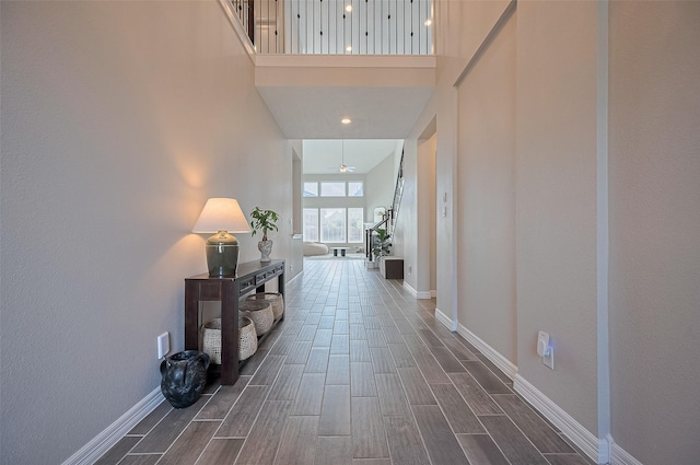 4107 Rainflower Ct, Fulshear, TX 77441 - corridor featuring wood tiled floors and a towering ceiling