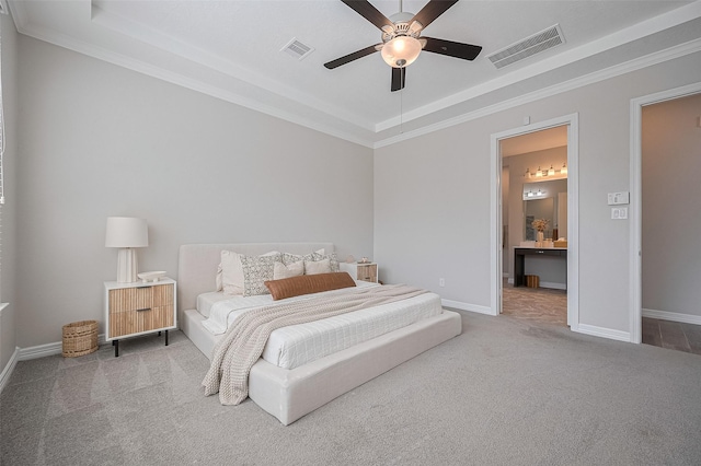 4107 Rainflower Ct, Fulshear, TX 77441 - carpeted bedroom with a tray ceiling, crown molding, a ceiling fan, and connected bathroom