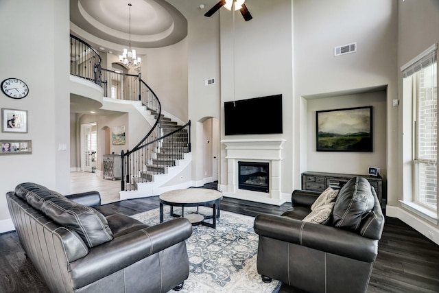 19222 Bullard Creek Dr, Cypress, TX 77433 - living area featuring a high ceiling, wood finished floors, stairway, a ceiling fan, and plenty of natural light