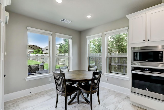 19222 Bullard Creek Dr, Cypress, TX 77433 - dining area featuring recessed lighting and light marble finish floors