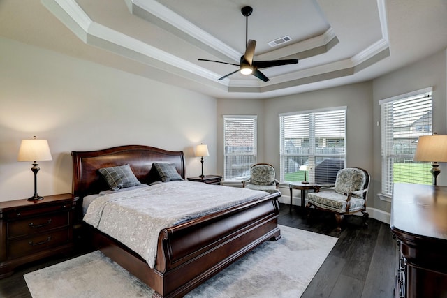 19222 Bullard Creek Dr, Cypress, TX 77433 - bedroom with ornamental molding, a raised ceiling, wood finished floors, and a ceiling fan