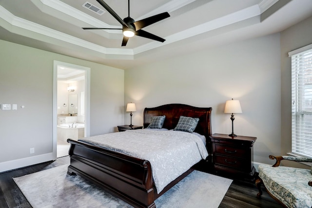 19222 Bullard Creek Dr, Cypress, TX 77433 - bedroom featuring a tray ceiling, dark wood finished floors, ornamental molding, ensuite bathroom, and ceiling fan
