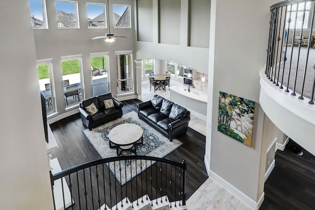 19222 Bullard Creek Dr, Cypress, TX 77433 - living area with ceiling fan, a towering ceiling, and wood finished floors