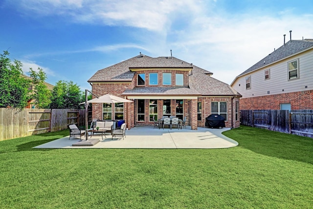 19222 Bullard Creek Dr, Cypress, TX 77433 - back of property featuring brick siding, a fenced backyard, an outdoor hangout area, and roof with shingles