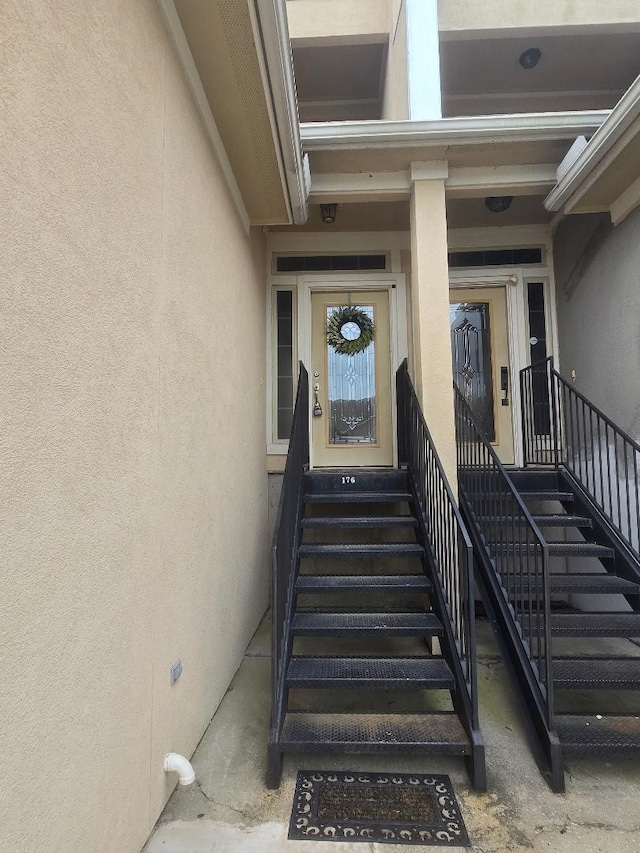 176 Capetown, Conroe, TX 77356 - property entrance featuring stucco siding
