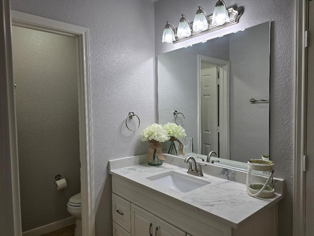 176 Capetown, Conroe, TX 77356 - bathroom featuring vanity and a textured wall