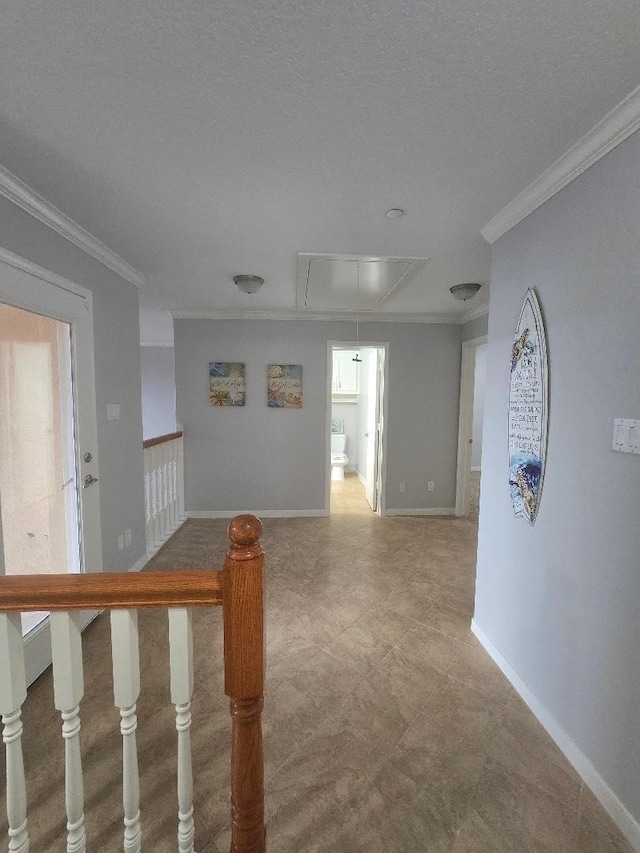 176 Capetown, Conroe, TX 77356 - spare room featuring attic access and crown molding