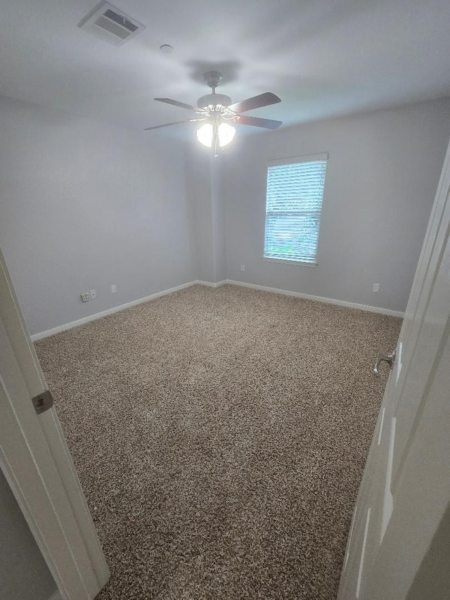 176 Capetown, Conroe, TX 77356 - carpeted empty room featuring baseboards and a ceiling fan