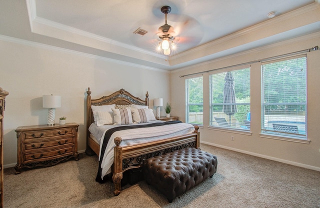 2512 Eagle Post Dr, Conroe, TX 77304 - carpeted bedroom with a tray ceiling, crown molding, and a ceiling fan