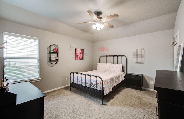 2512 Eagle Post Dr, Conroe, TX 77304 - bedroom with light colored carpet and ceiling fan
