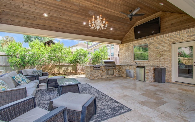 2512 Eagle Post Dr, Conroe, TX 77304 - fenced backyard featuring an outdoor kitchen, an outdoor living space, a patio area, and a ceiling fan