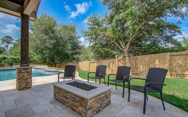 2512 Eagle Post Dr, Conroe, TX 77304 - fenced backyard with a fire pit and a patio area