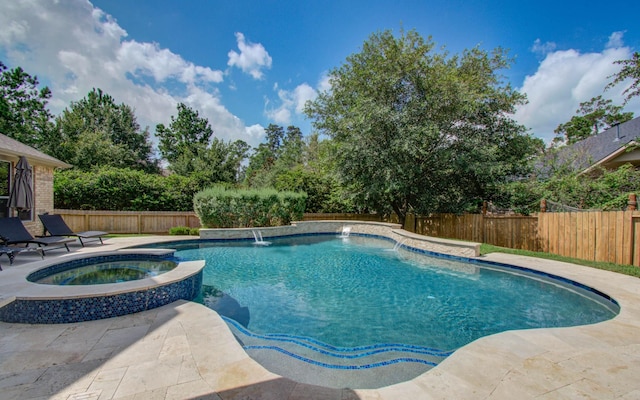 2512 Eagle Post Dr, Conroe, TX 77304 - view of swimming pool with a fenced backyard, a pool with connected hot tub, and a patio