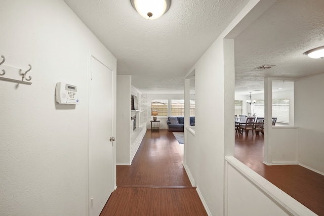 411 Pickford Dr, Katy, TX 77450 - hall featuring a textured ceiling and wood finished floors