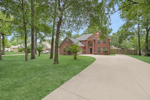 5918 Mahogany Way, Magnolia, TX 77354 - traditional-style house with driveway, brick siding, and a garage