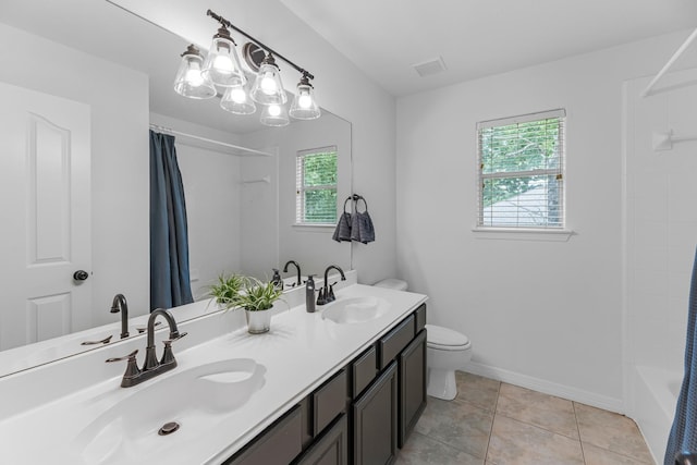 5918 Mahogany Way, Magnolia, TX 77354 - full bathroom featuring double vanity, shower / tub combo, and tile patterned flooring