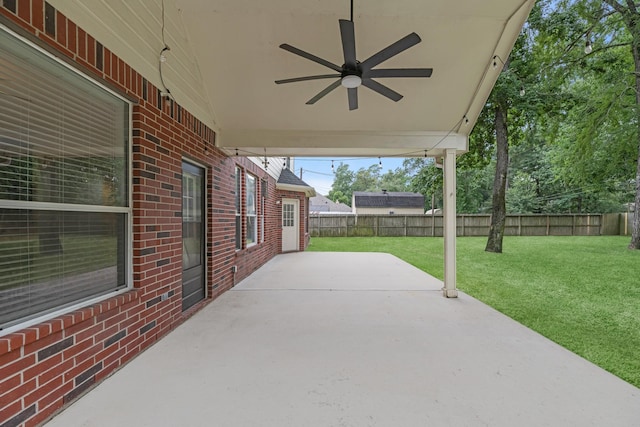 5918 Mahogany Way, Magnolia, TX 77354 - fenced backyard featuring a patio and a ceiling fan