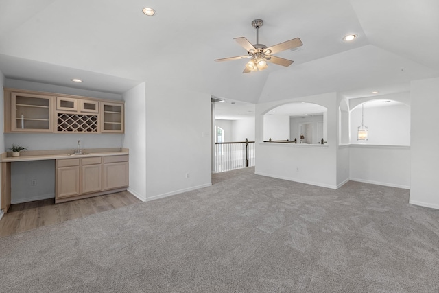 5918 Mahogany Way, Magnolia, TX 77354 - unfurnished living room featuring light carpet, wet bar, lofted ceiling, recessed lighting, and a ceiling fan