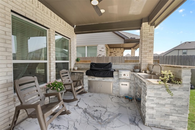 17735 Tree Of Heaven, Conroe, TX 77385 - view of patio with a sink and an outdoor kitchen