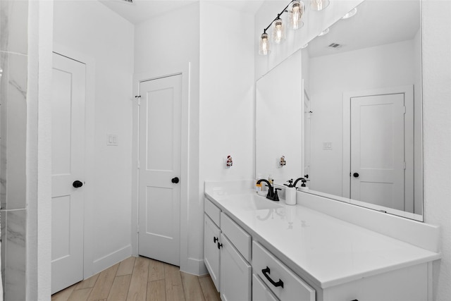 17735 Tree Of Heaven, Conroe, TX 77385 - bathroom featuring vanity and wood finished floors