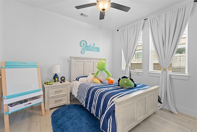 17735 Tree Of Heaven, Conroe, TX 77385 - bedroom featuring light wood-style floors and a ceiling fan