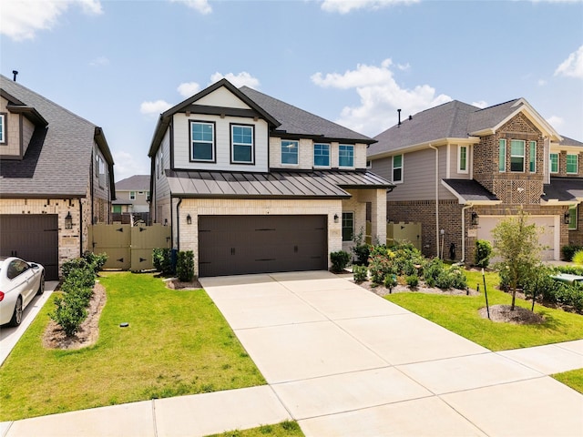 17735 Tree Of Heaven, Conroe, TX 77385 - view of front facade with a standing seam roof, brick siding, an attached garage, concrete driveway, and a metal roof