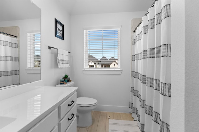 17735 Tree Of Heaven, Conroe, TX 77385 - full bath with vanity, wood finished floors, healthy amount of natural light, and curtained shower