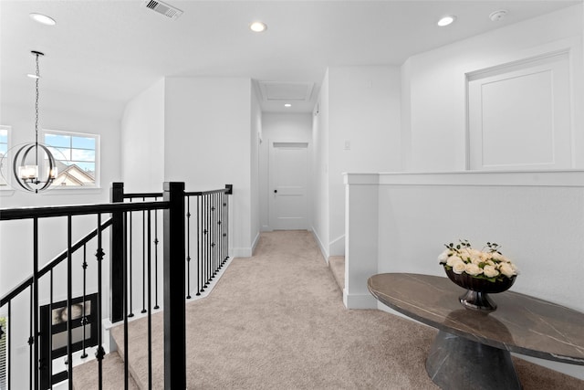 17735 Tree Of Heaven, Conroe, TX 77385 - hall featuring light colored carpet, an upstairs landing, recessed lighting, and a chandelier