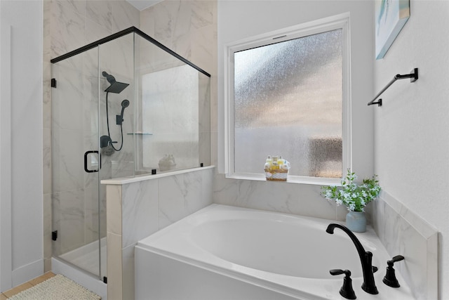 17735 Tree Of Heaven, Conroe, TX 77385 - full bath featuring a garden tub, a marble finish shower, and healthy amount of natural light