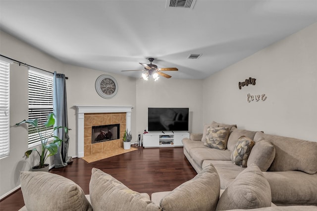 4714 Rumbling Canyon Ct, Katy, TX 77449 - living area with a ceiling fan, a tiled fireplace, and wood finished floors