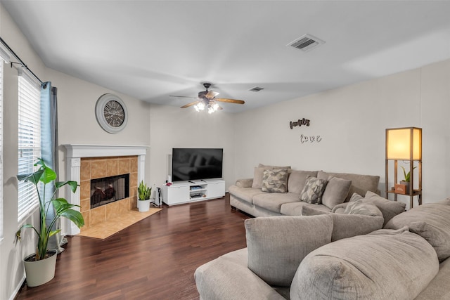 4714 Rumbling Canyon Ct, Katy, TX 77449 - living room featuring a ceiling fan, dark wood-style floors, and a fireplace
