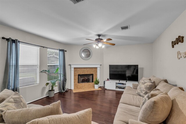 4714 Rumbling Canyon Ct, Katy, TX 77449 - living room with ceiling fan, dark wood-style flooring, and a tiled fireplace