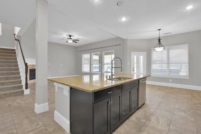 18618 Bridle Grove Ct, Tomball, TX 77377 - kitchen featuring ceiling fan, hanging light fixtures, light stone counters, recessed lighting, and dishwasher
