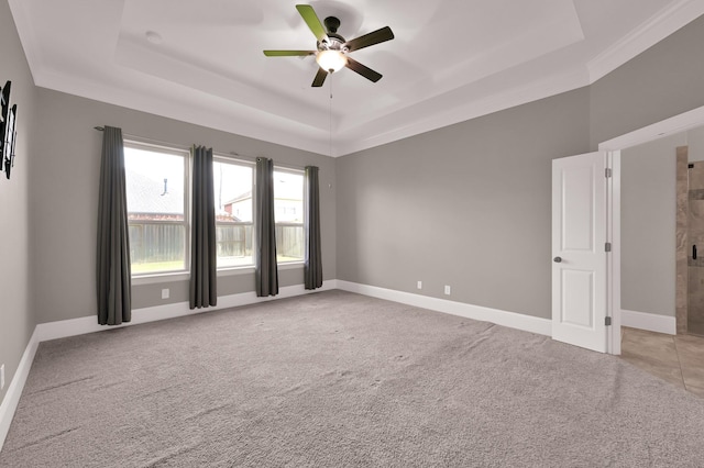 18618 Bridle Grove Ct, Tomball, TX 77377 - unfurnished room with a raised ceiling, a ceiling fan, light carpet, and crown molding