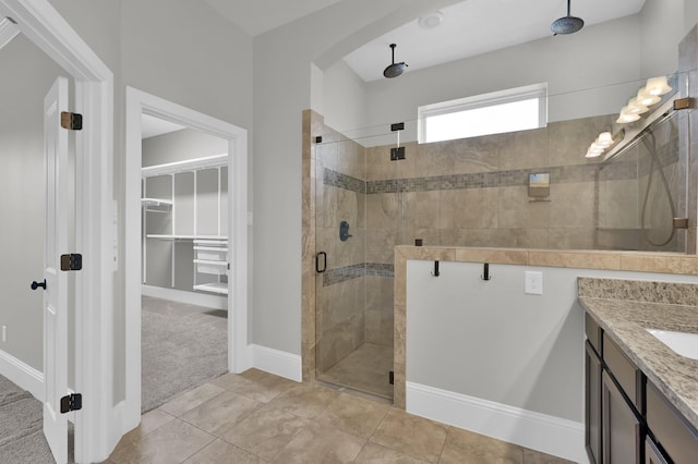 18618 Bridle Grove Ct, Tomball, TX 77377 - full bathroom with a stall shower, a spacious closet, and vanity
