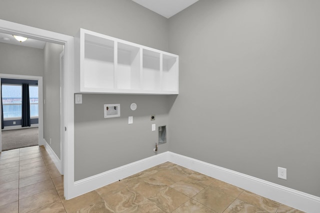 18618 Bridle Grove Ct, Tomball, TX 77377 - laundry area featuring gas dryer hookup, electric dryer hookup, washer hookup, and light tile patterned flooring