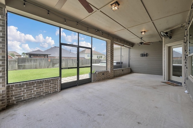 18618 Bridle Grove Ct, Tomball, TX 77377 - unfurnished sunroom featuring ceiling fan, a residential view, and area for grilling