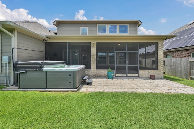 18618 Bridle Grove Ct, Tomball, TX 77377 - rear view of property featuring a hot tub, a sunroom, a patio area, and brick siding