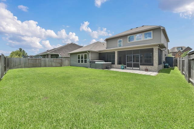 18618 Bridle Grove Ct, Tomball, TX 77377 - rear view of property featuring a hot tub, brick siding, a fenced backyard, a sunroom, and a patio area