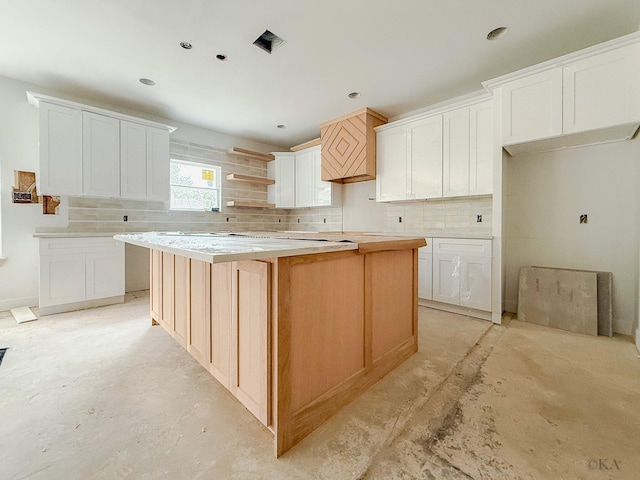 10651 Mayfield Rd, Houston, TX 77043 - kitchen with backsplash, a kitchen island, concrete flooring, open shelves, and recessed lighting