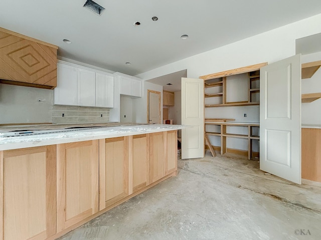 10651 Mayfield Rd, Houston, TX 77043 - kitchen featuring open shelves, tasteful backsplash, stovetop, concrete flooring, and light brown cabinetry