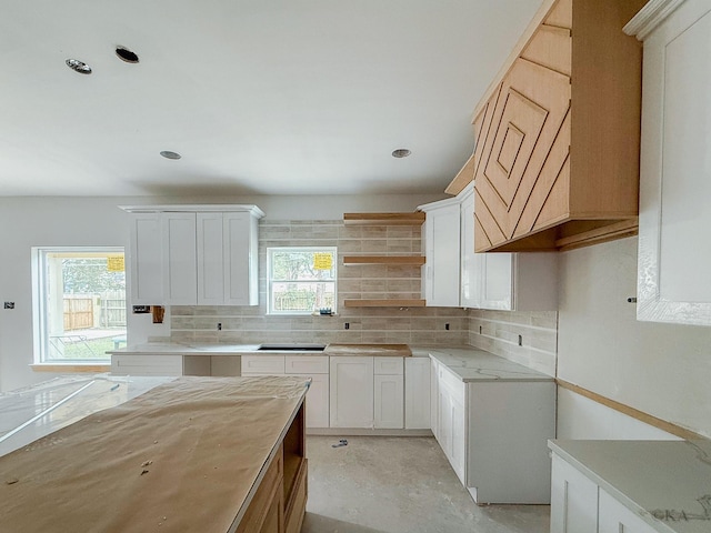10651 Mayfield Rd, Houston, TX 77043 - kitchen featuring backsplash, light countertops, open shelves, concrete floors, and recessed lighting