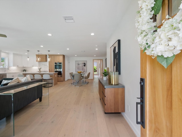 10651 Mayfield Rd, Houston, TX 77043 - entrance foyer with light wood-style flooring, recessed lighting, and healthy amount of natural light