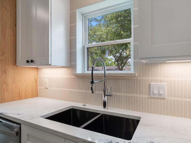 10651 Mayfield Rd, Houston, TX 77043 - kitchen with light stone countertops, healthy amount of natural light, and dishwashing machine