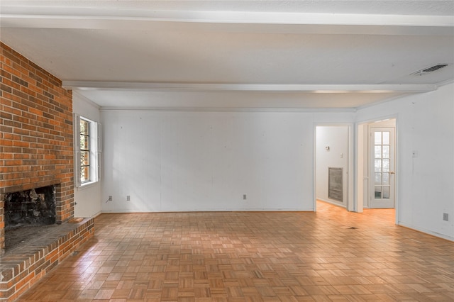 3799 Summer Ln, Huntsville, TX 77340 - unfurnished living room featuring a brick fireplace and beamed ceiling