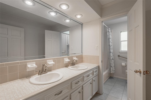3799 Summer Ln, Huntsville, TX 77340 - bathroom featuring double vanity, tile patterned flooring, tasteful backsplash, shower / bath combination with curtain, and ornamental molding