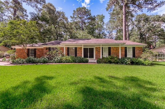 3799 Summer Ln, Huntsville, TX 77340 - single story home featuring a front lawn and brick siding